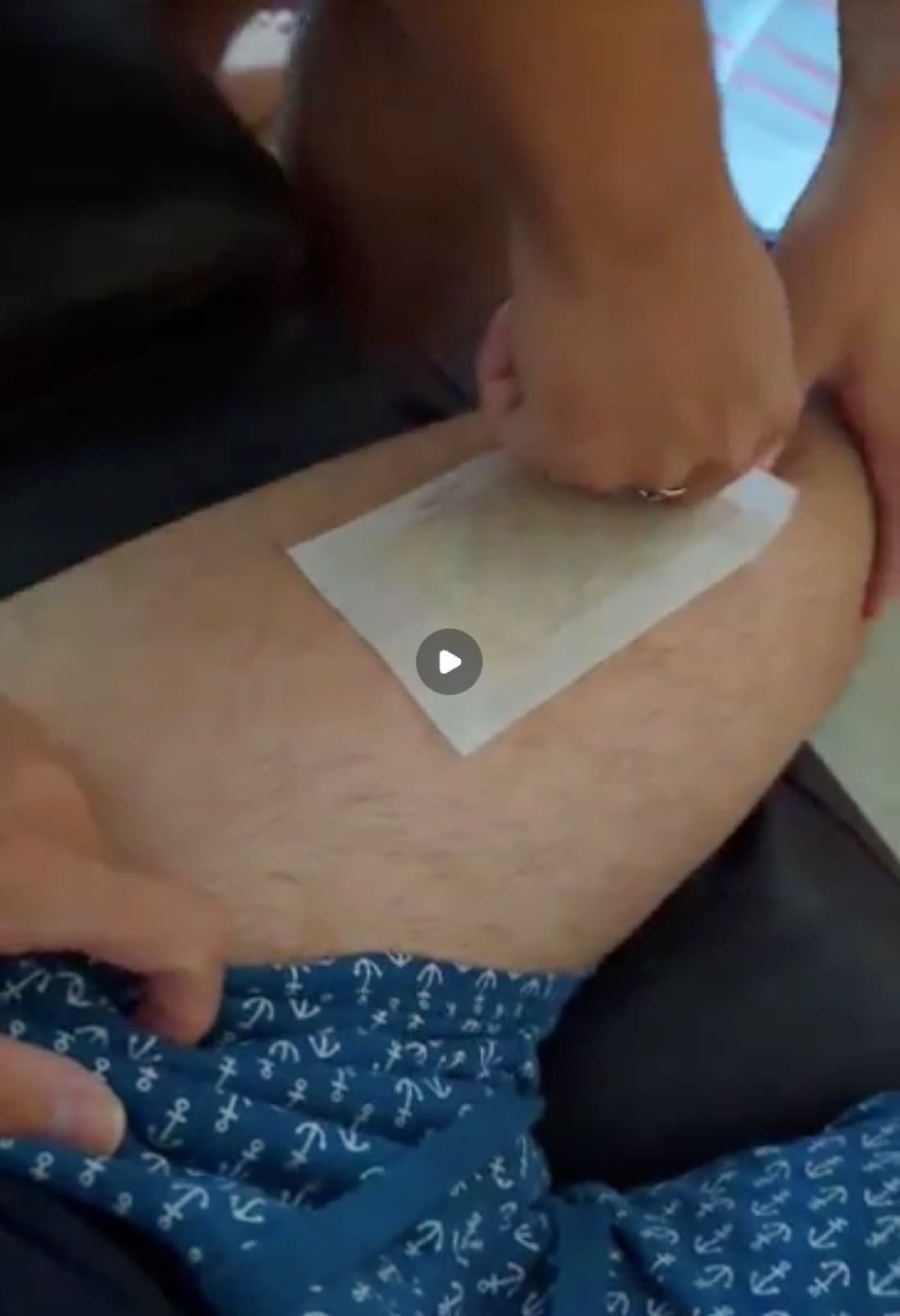 Peter Ho getting his leg waxed