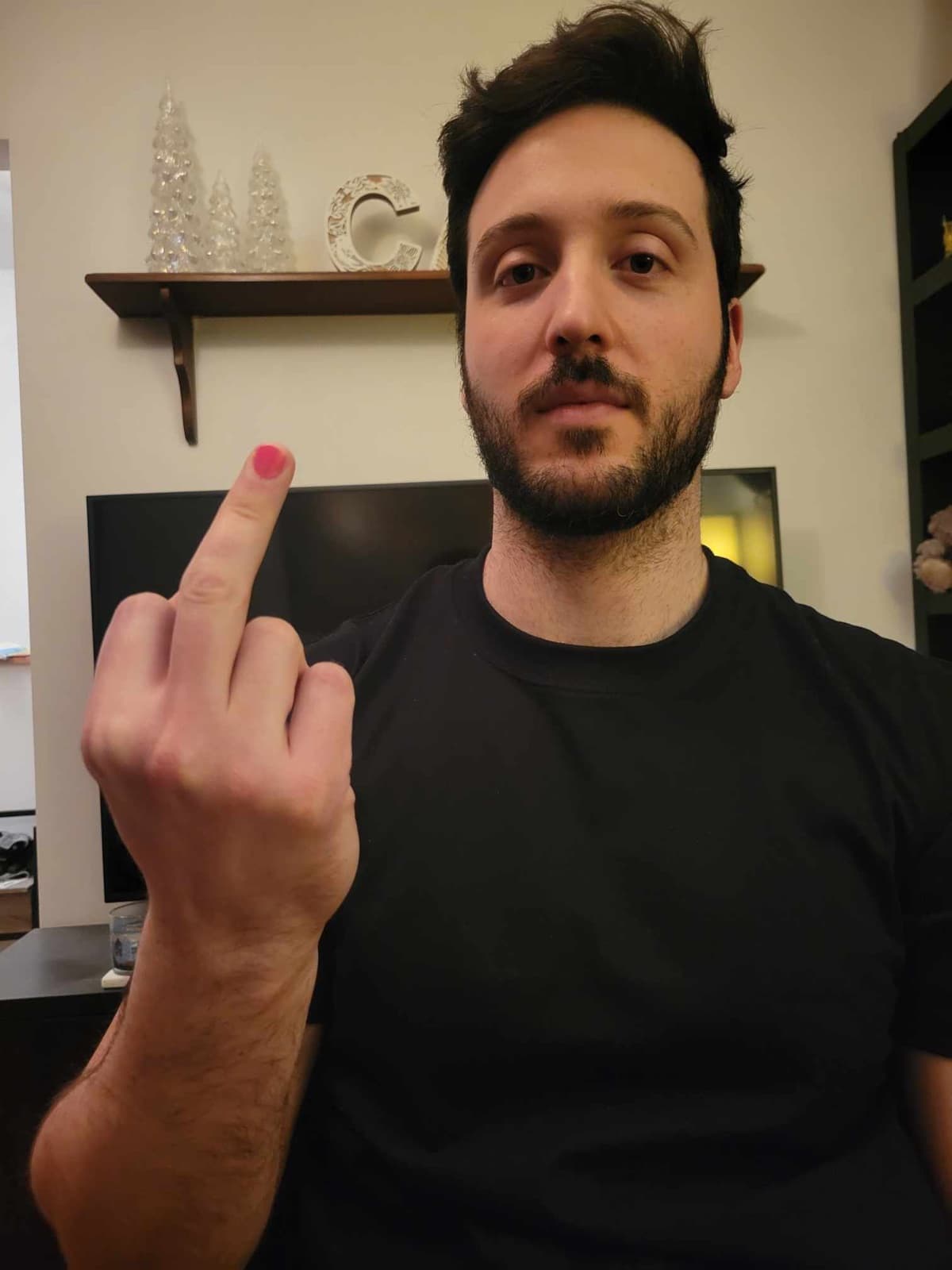 Ali showing his pink-painted fingernails