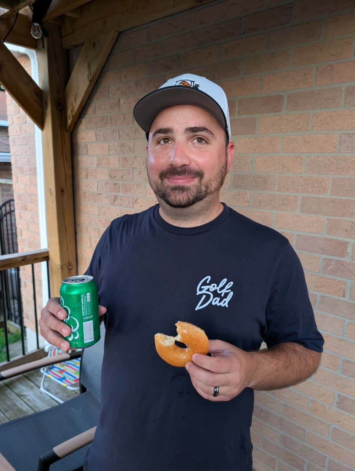 Dave holding a bagel and a drink during the 24 in 24 challenge